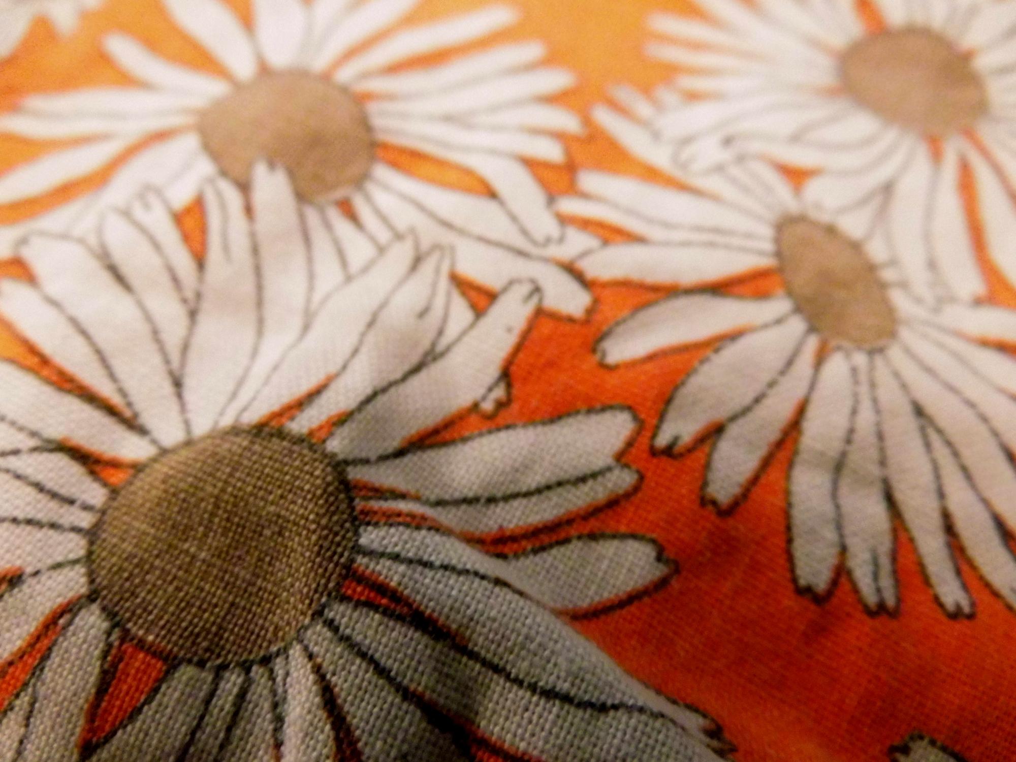 close-up of modern embroidered floral motif on linen