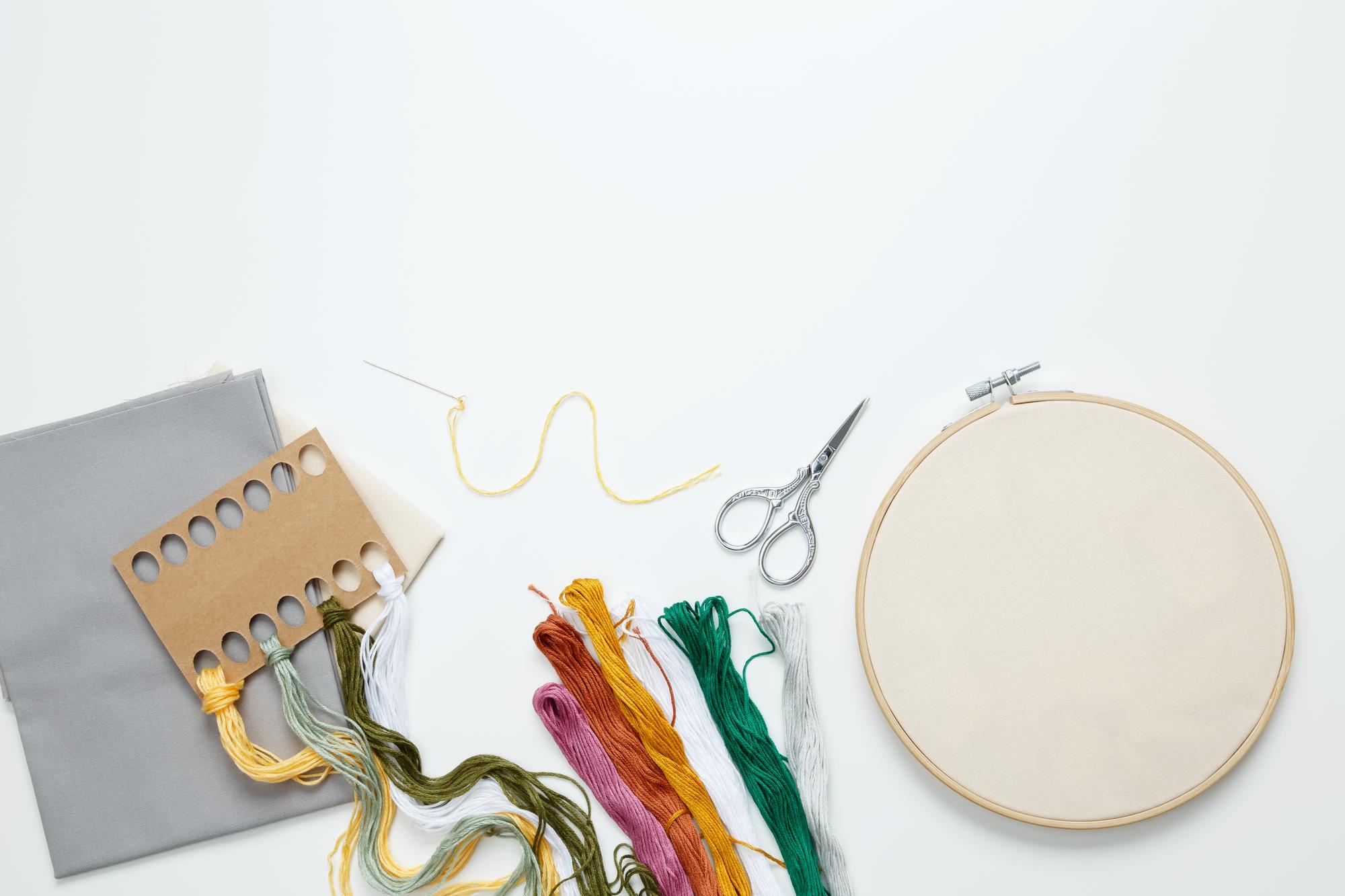 flatlay of embroidered samples and sketches